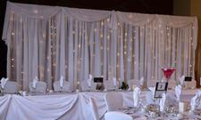 White backdrop from Always Invited Event Rentals