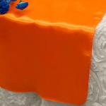Orange Satin Runner from Always Invited Event Rentals